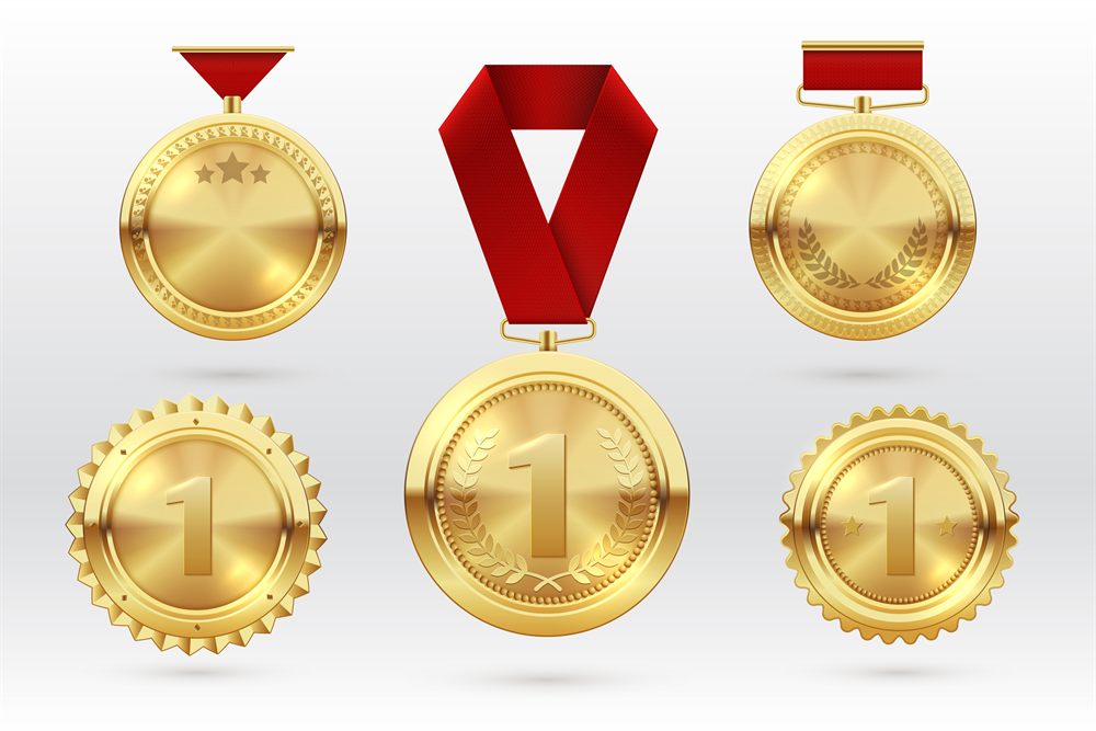 Gold first-place medals with ribbons arranged on a light background