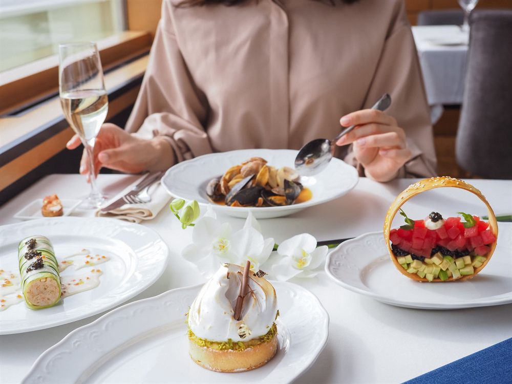 Elegant plated desserts and champagne on a restaurant table